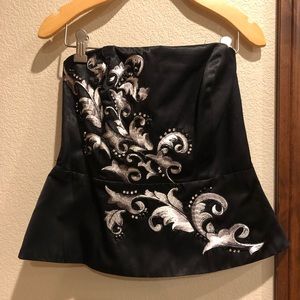 Black fitted tube top with embroidery detail